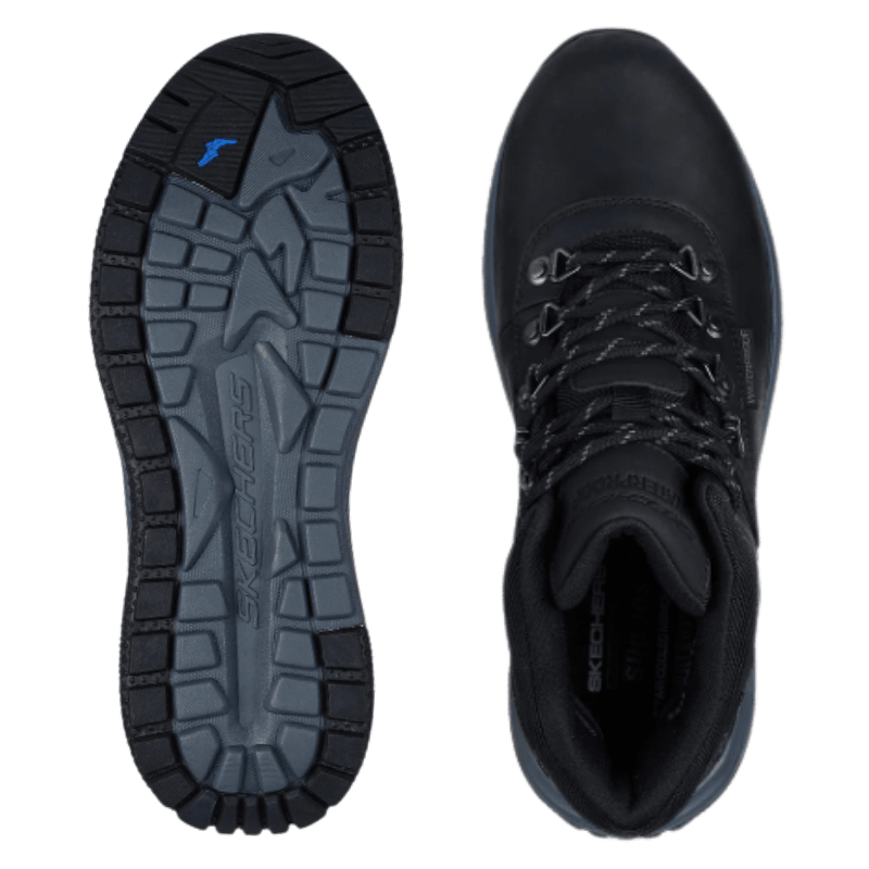 Twee zwarte Skechers herenboots, één bovenaanzicht en de andere toont het zoolpatroon